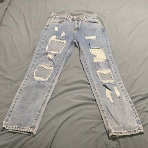 Ripped, high-waisted denim jeans
